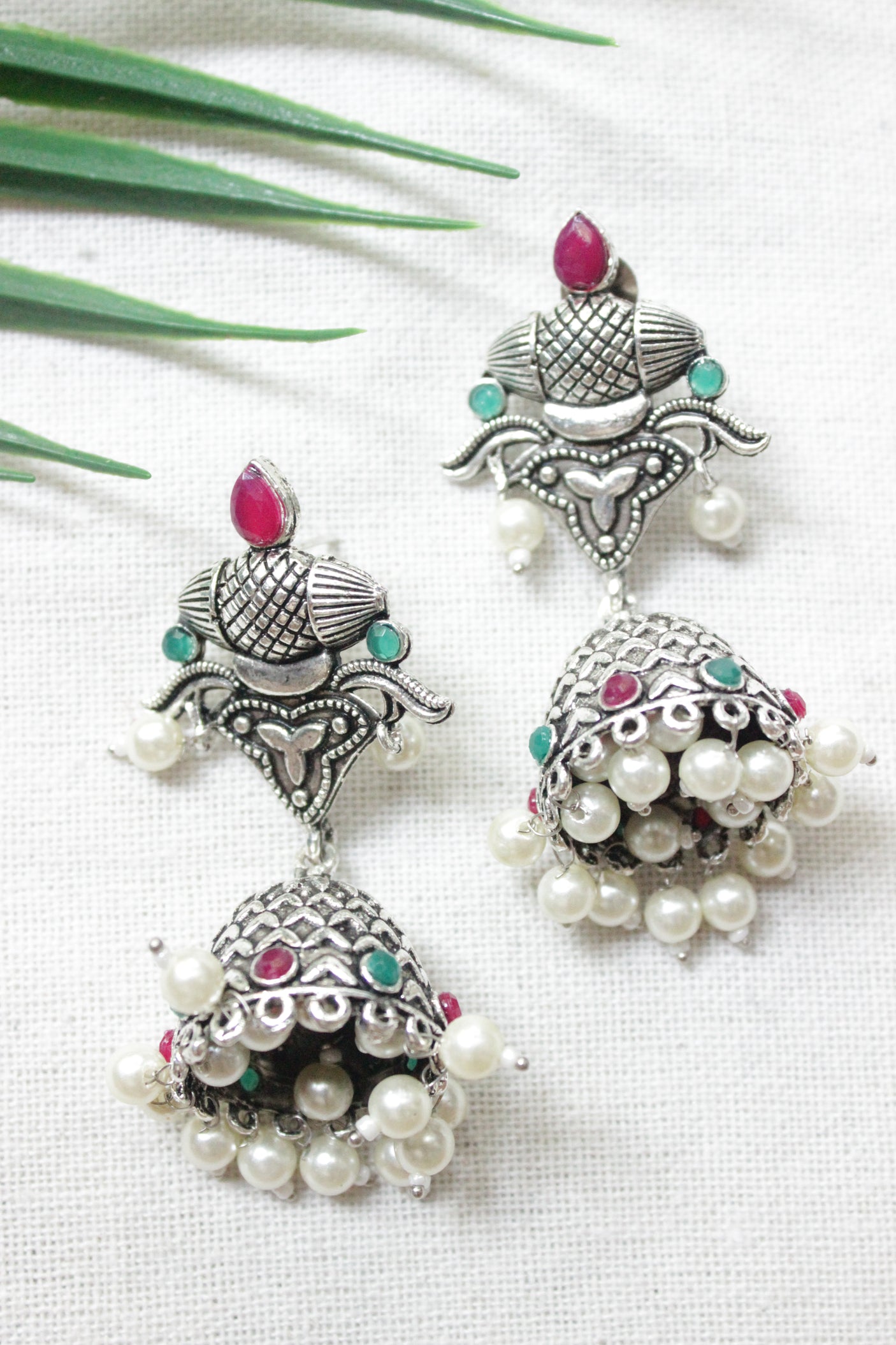 Ruby Red and Green Glass Stones Embedded Oxidised Finish Jhumka Earrings