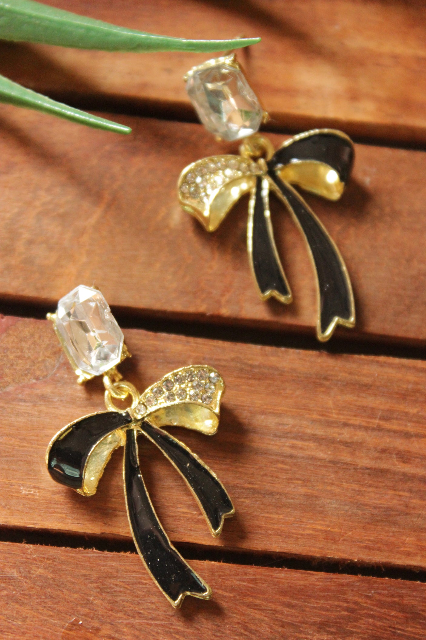 Bow Shaped Gold Toned Glass Stone Embedded Stud Earrings