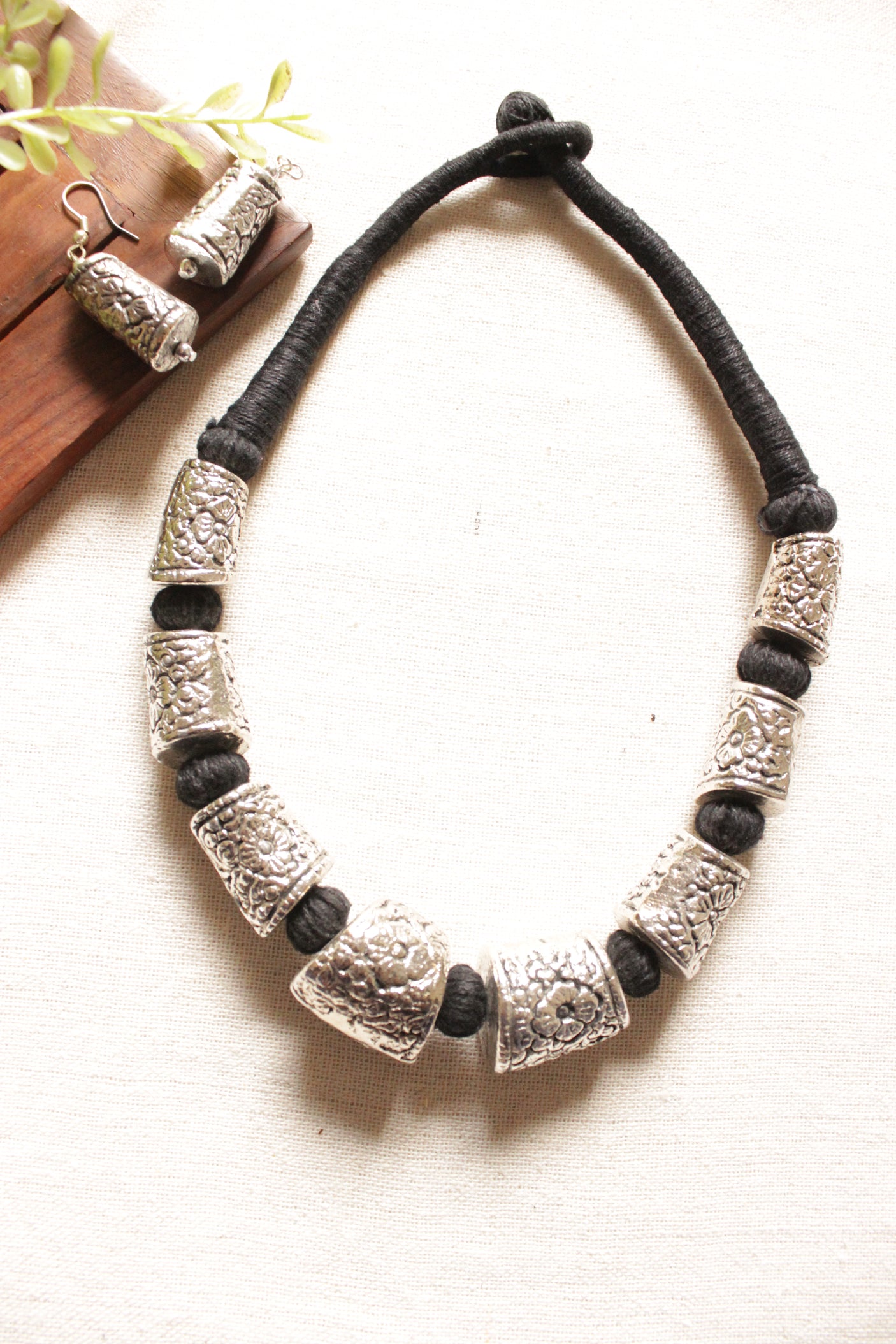 Intricately Detailed Metal Accents Braided with Black Fabric Threads Necklace Set