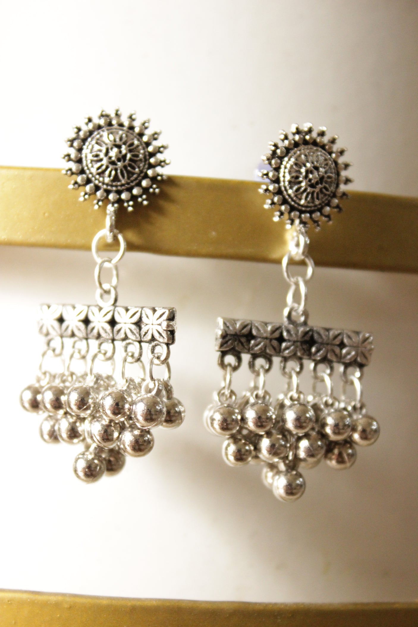 Ghungroo Beads Embellished Oxidised Finish Sun Motif Dangler Earrings