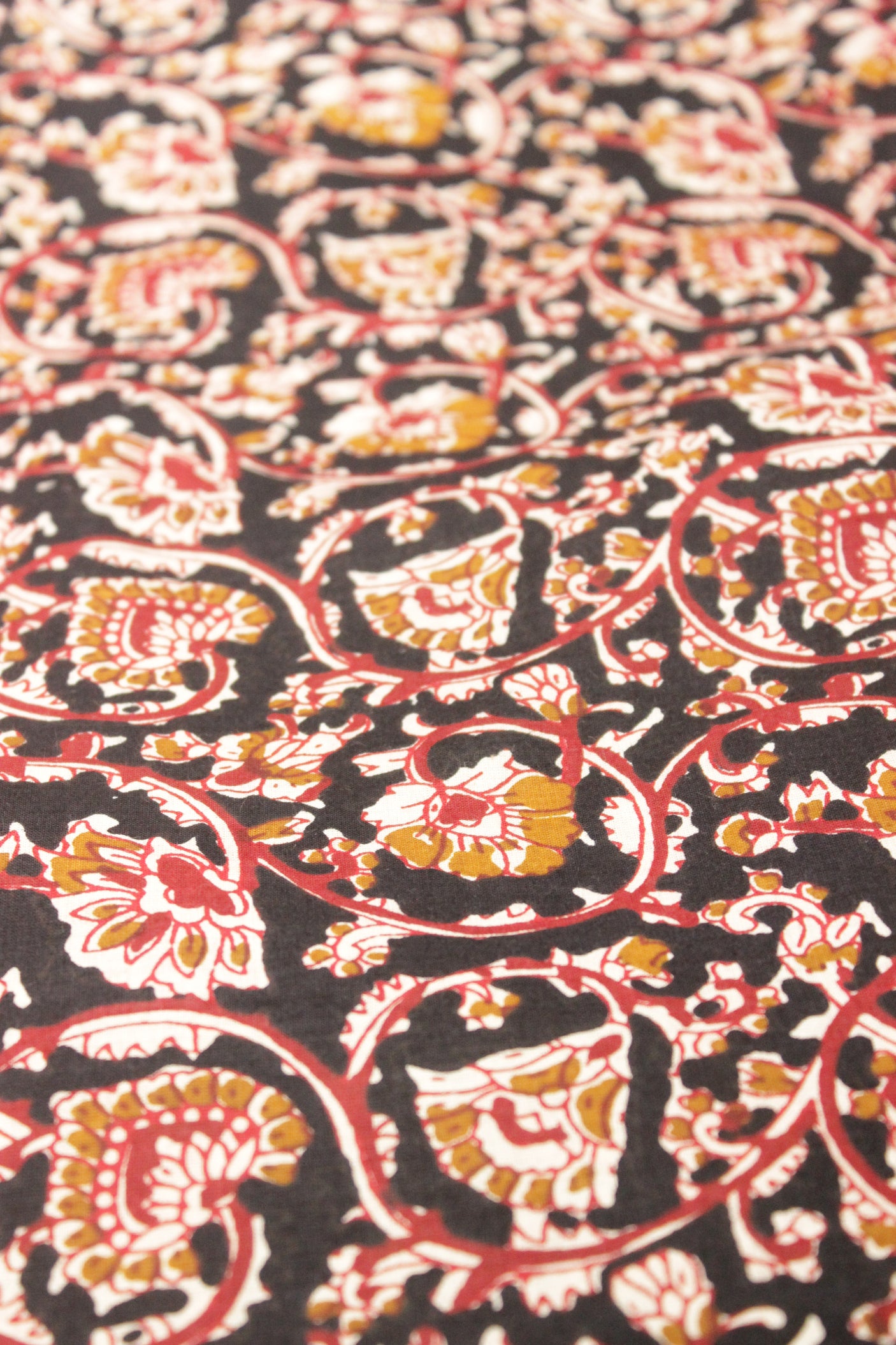 Dune Black with Mustard and Red Earthy Tones Kalamkari Pattern Digital Print Premium Cotton Fabric with Flower Motifs