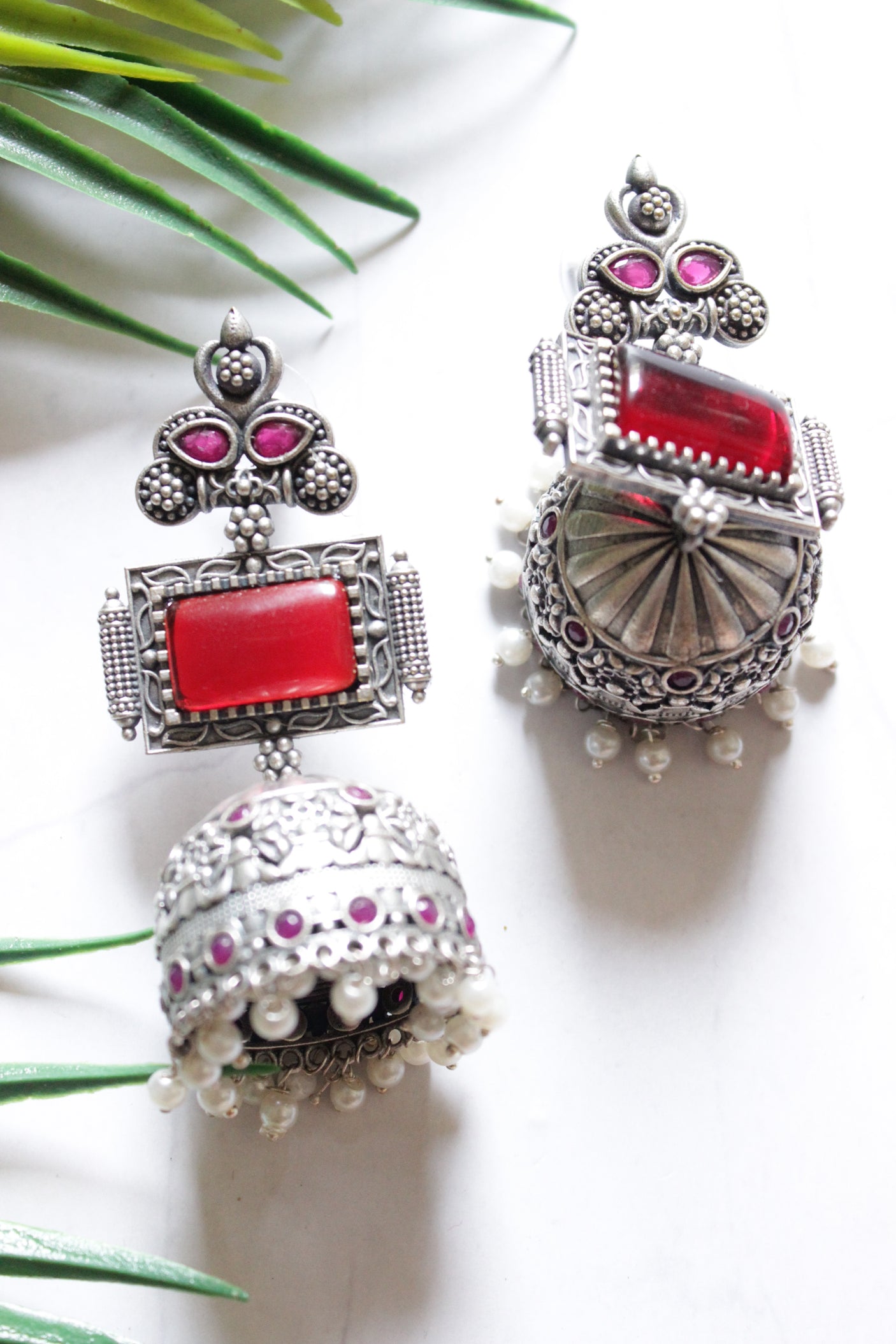 Red and Pink Stones Embellished Oxidised Finish Jhumka Earrings