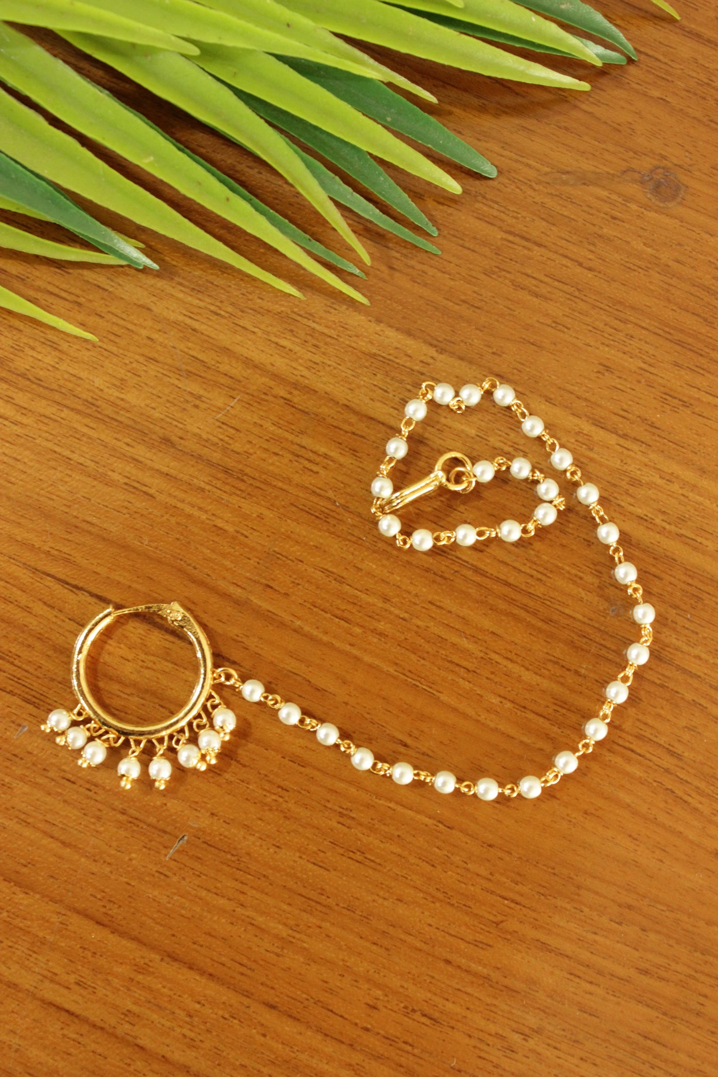 White Pearls Embellished Gold Finish Pierced Nosepin/Nose Ring with Chain