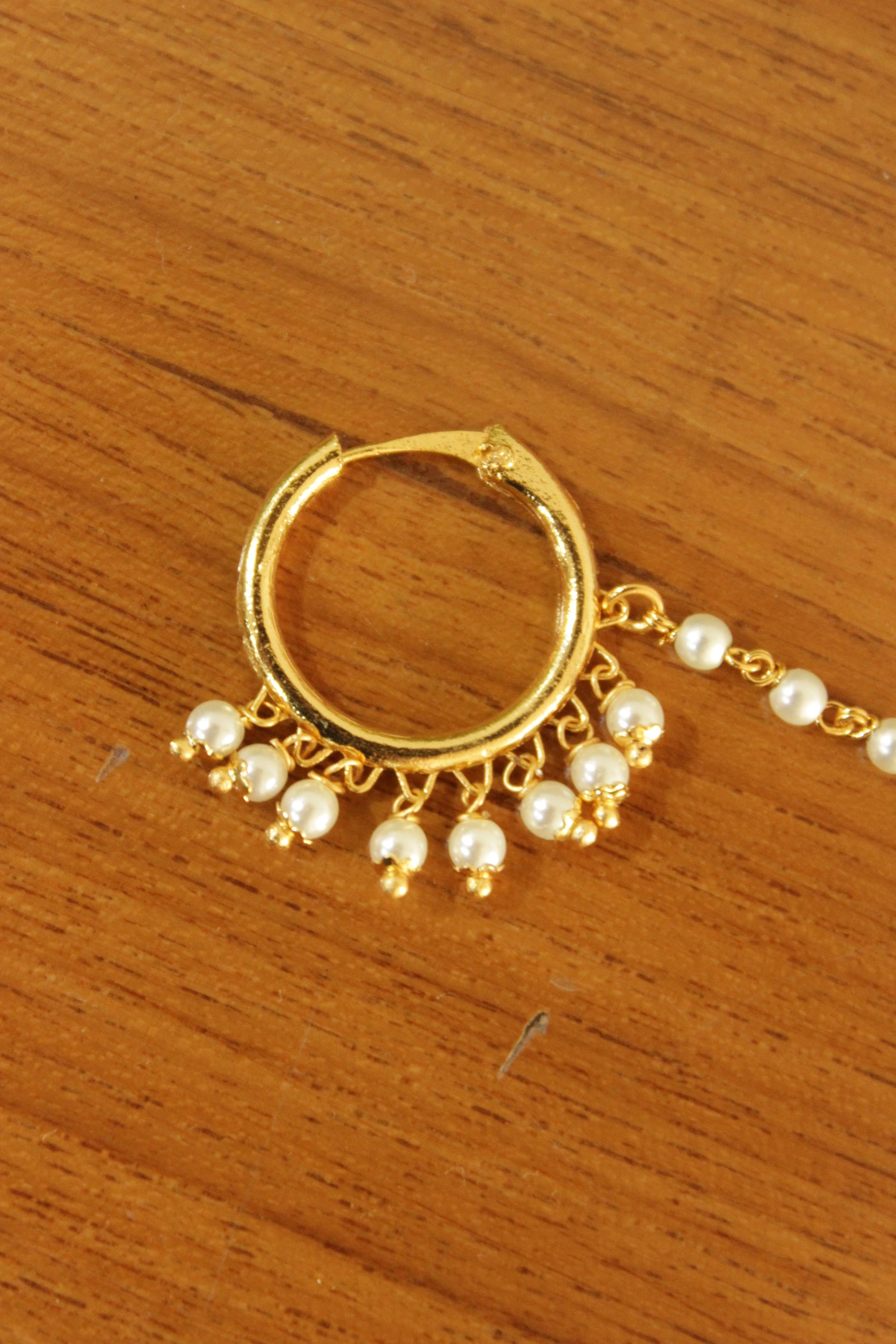 White Pearls Embellished Gold Finish Pierced Nosepin/Nose Ring with Chain