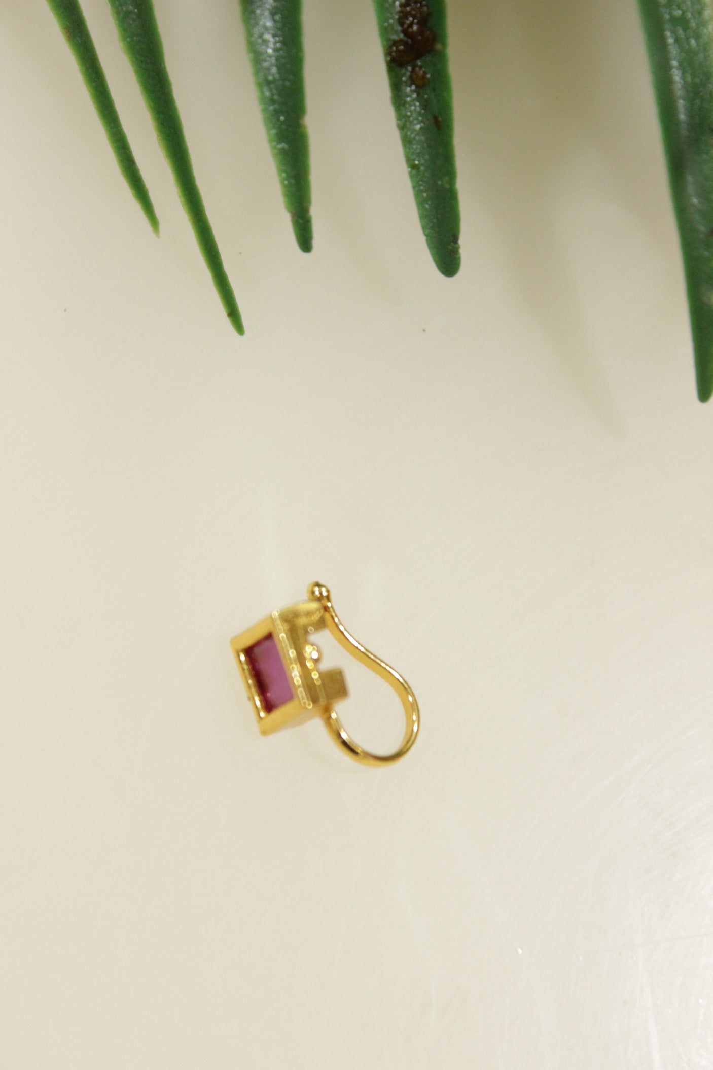 Ruby Red Glass Stone Embedded Gold Finish Clip On Nosepin