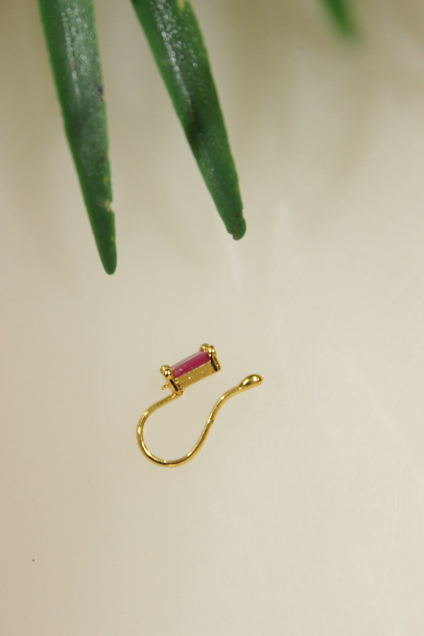 Ruby Pink Glass Stone Embedded Gold Finish Clip On Nosepin