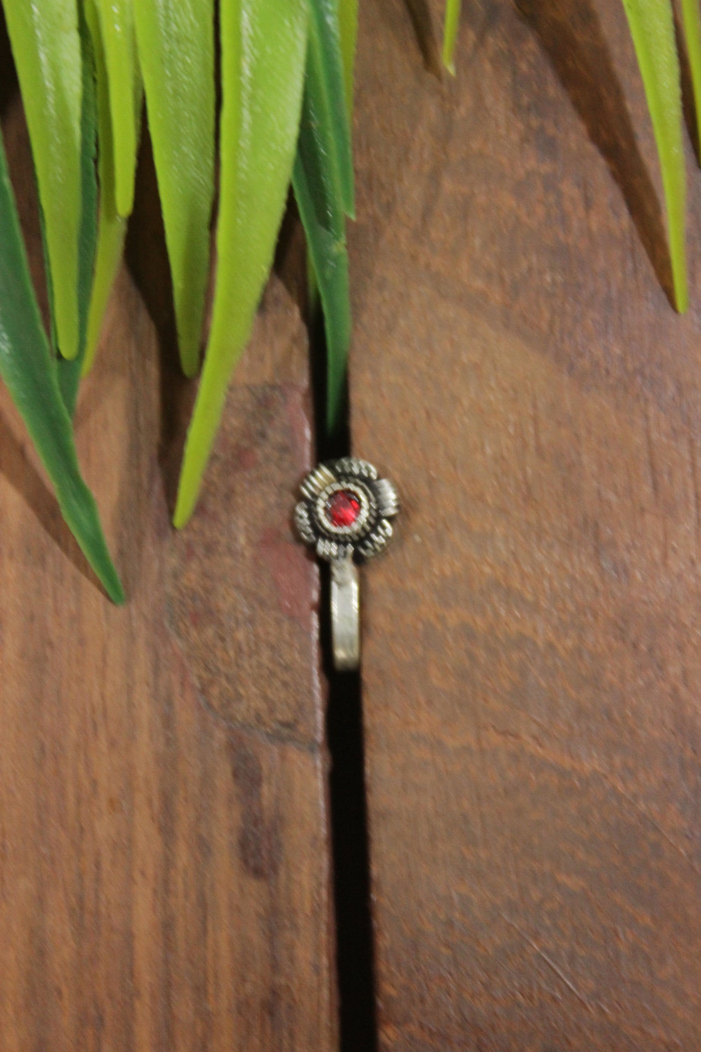 Red Center Stone Embedded Flower Shape Oxidised Finish Clip On Nosepin