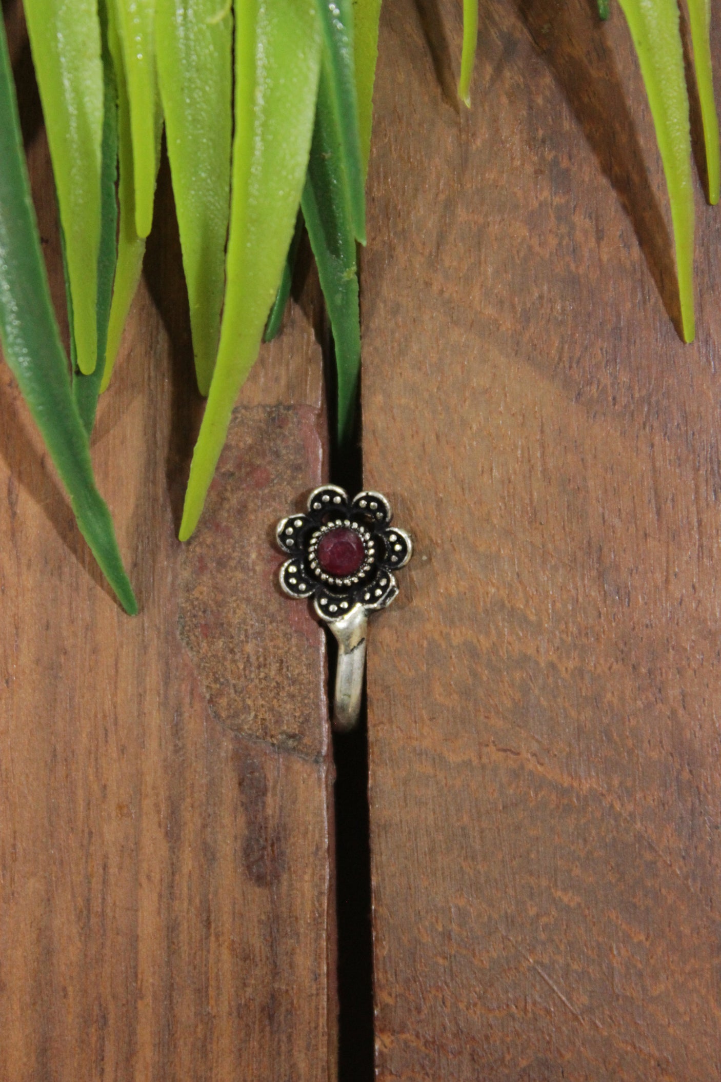 Ruby Red Center Stone Embedded Flower Shape Oxidised Finish Clip On Nosepin