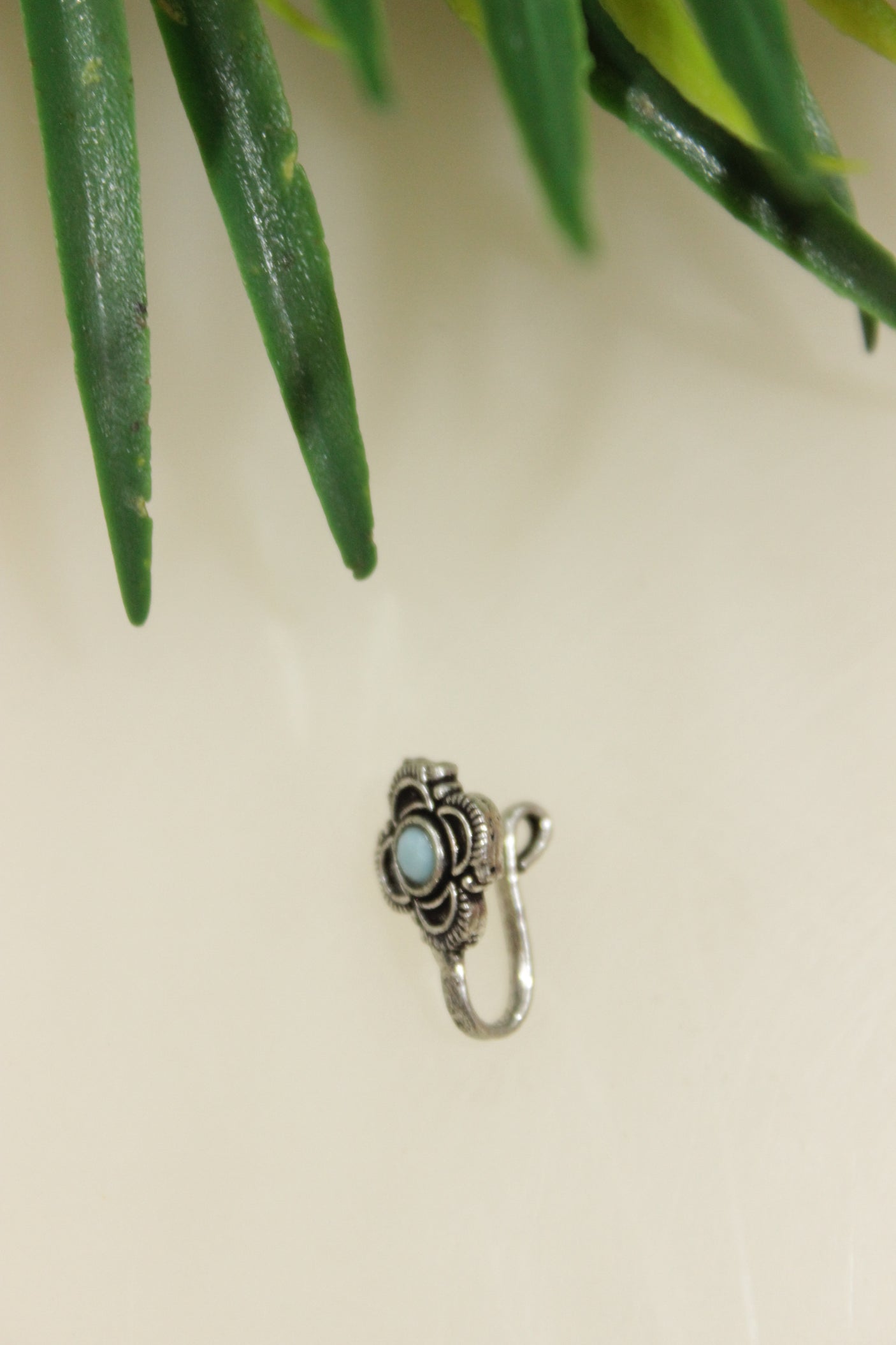 Blue Center Stone Embedded Floral Oxidised Finish Clip On Nosepin