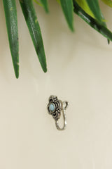 Blue Center Stone Embedded Floral Oxidised Finish Clip On Nosepin