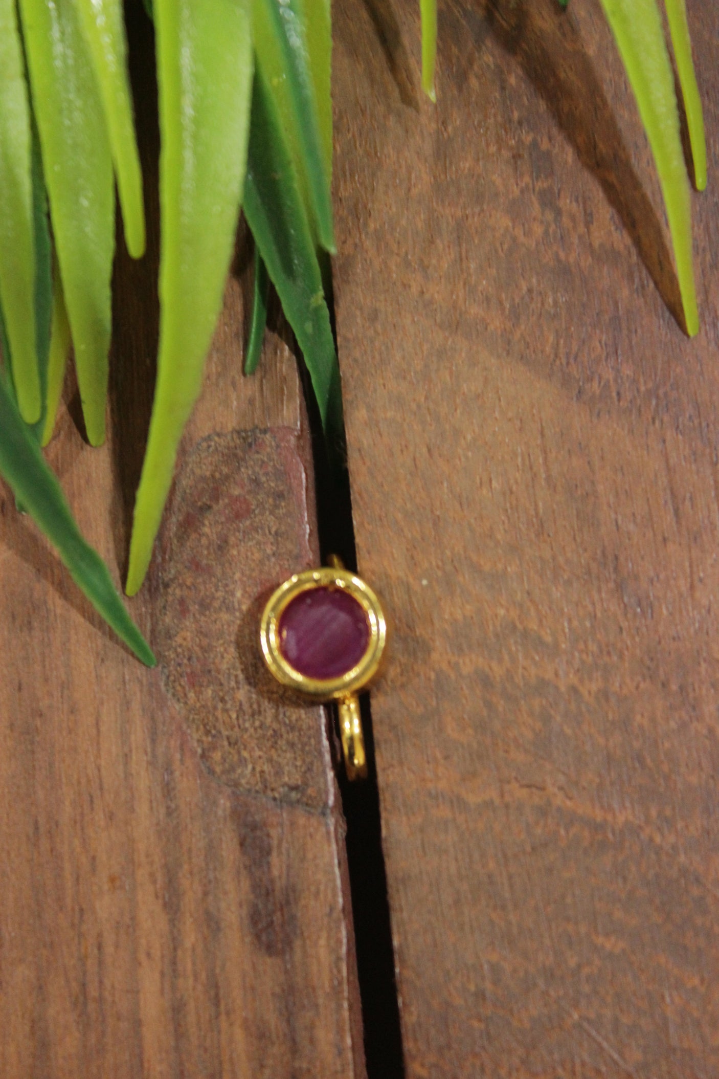 Circular Ruby Pink Glass Stone Embedded Gold Finish Clip On Nosepin