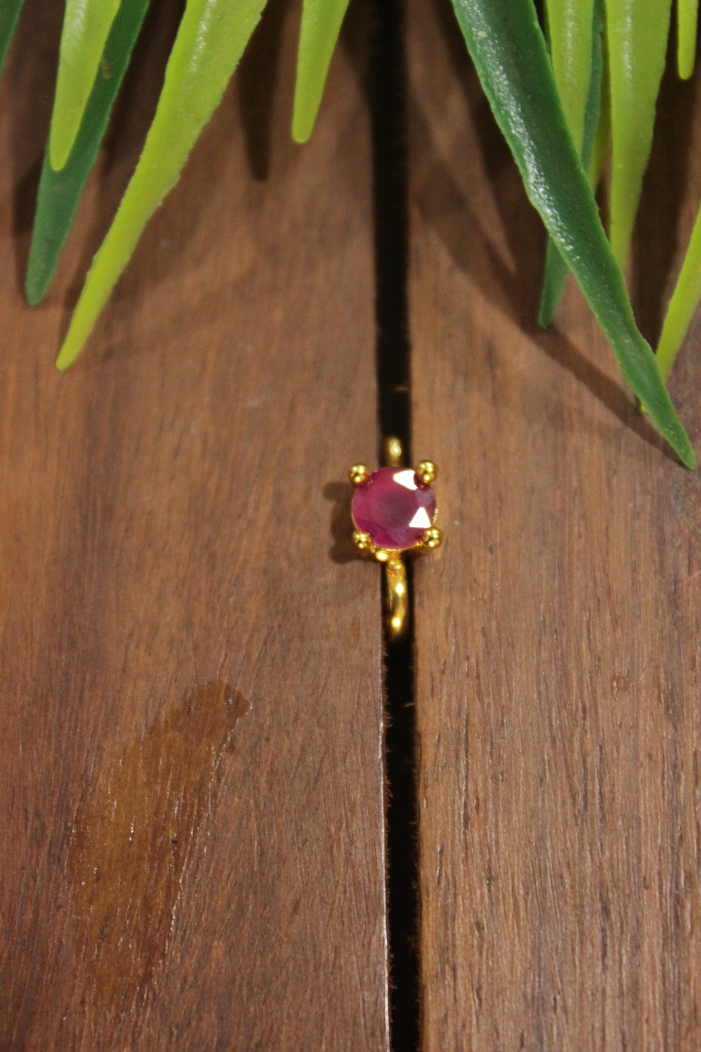 Ruby Pink Glass Stone Embedded Gold Finish Clip On Nosepin