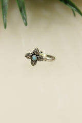 Blue Center Stone Embedded Flower Shape Oxidised Finish Clip On Nosepin