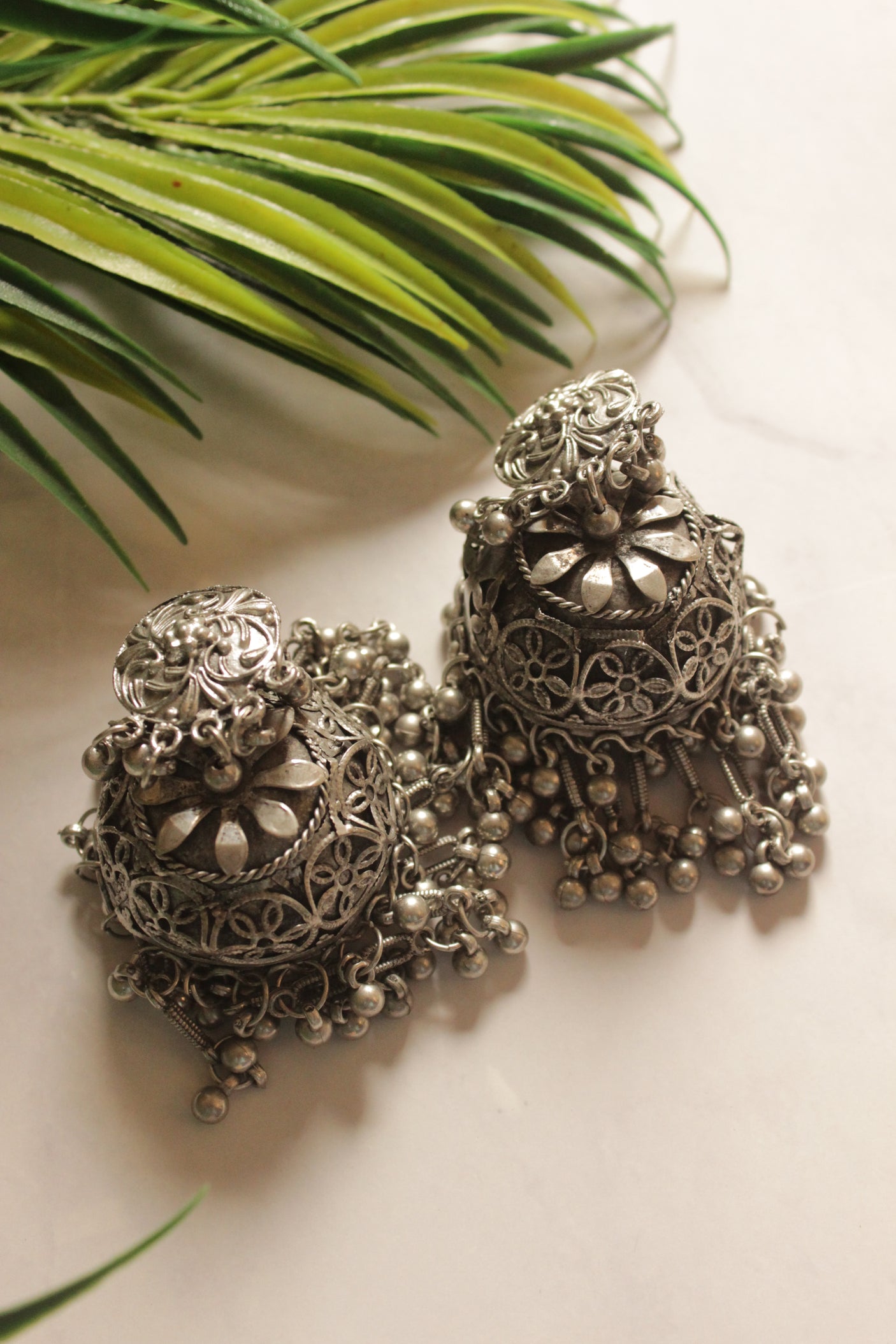 Flower Embossed Oxidised Finish Jhumka Earrings