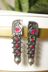 Fuchsia Glass Stones Embedded Peacock Motif Oxidised Finish Versatile Long Dangler Earrings