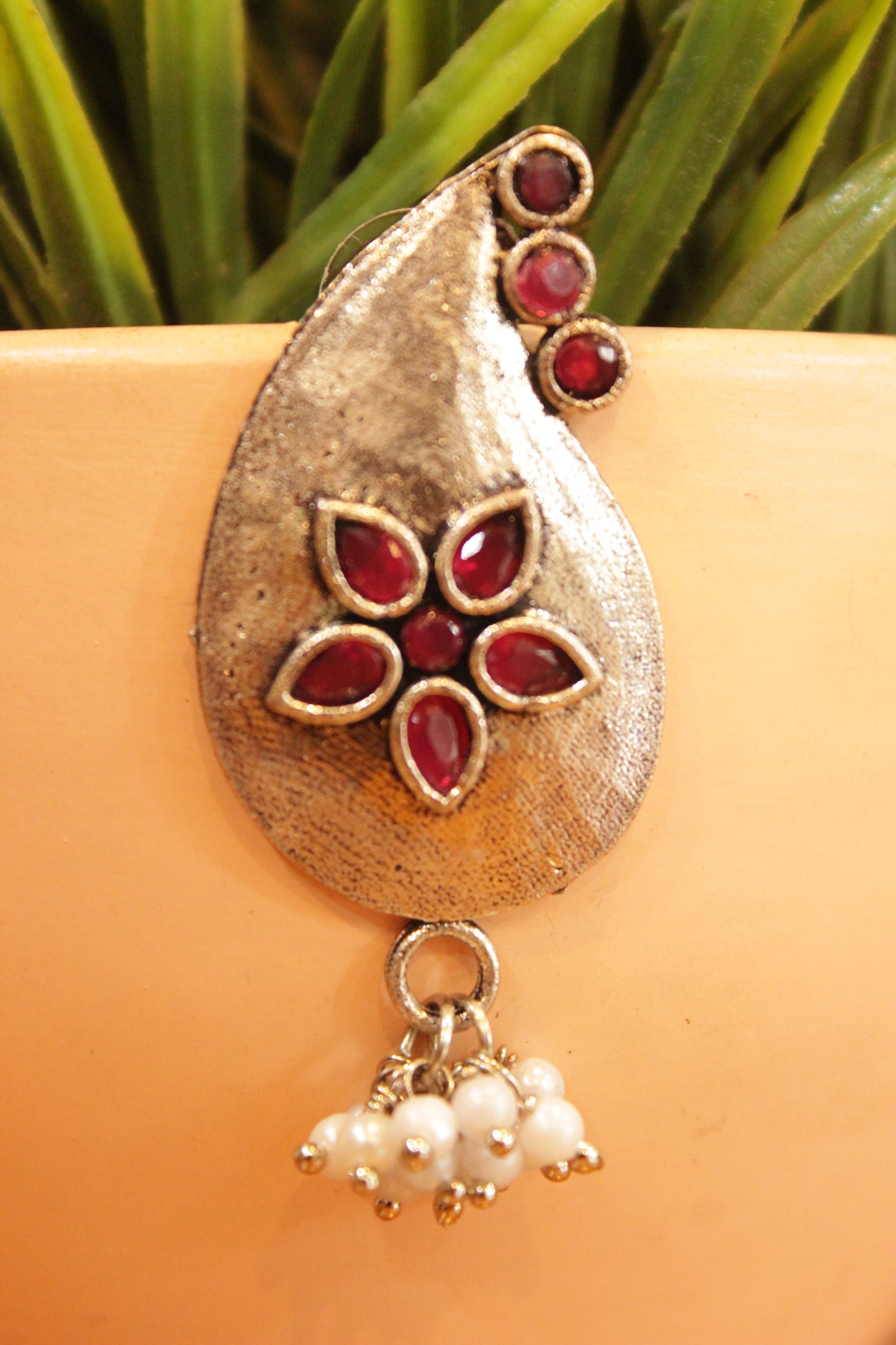 Tear Drop Shape Red Stones Embedded Flower Motifs Oxidised Finish Earrings