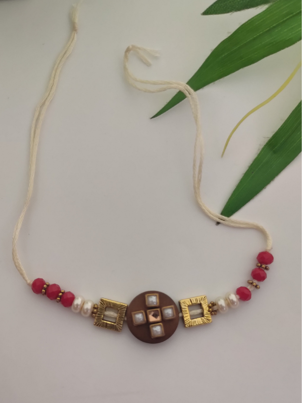 Simple Yet Elegant Wooden Centerpiece Rakhi with Metal and Beads Detailing