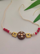 Simple Yet Elegant Wooden Centerpiece Rakhi with Metal and Beads Detailing