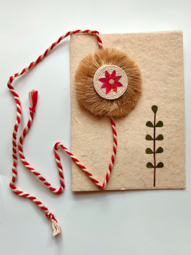 Eco-Friendly Handmade Jute Flower Rakhi with Dried Leaves and Flower Petals (Comes with a Reusable Cloth Pouch and Recycled Paper Card)