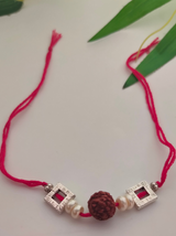 Rudraksha Bead, White Beads and Metal Rakhi with Cotton Thread