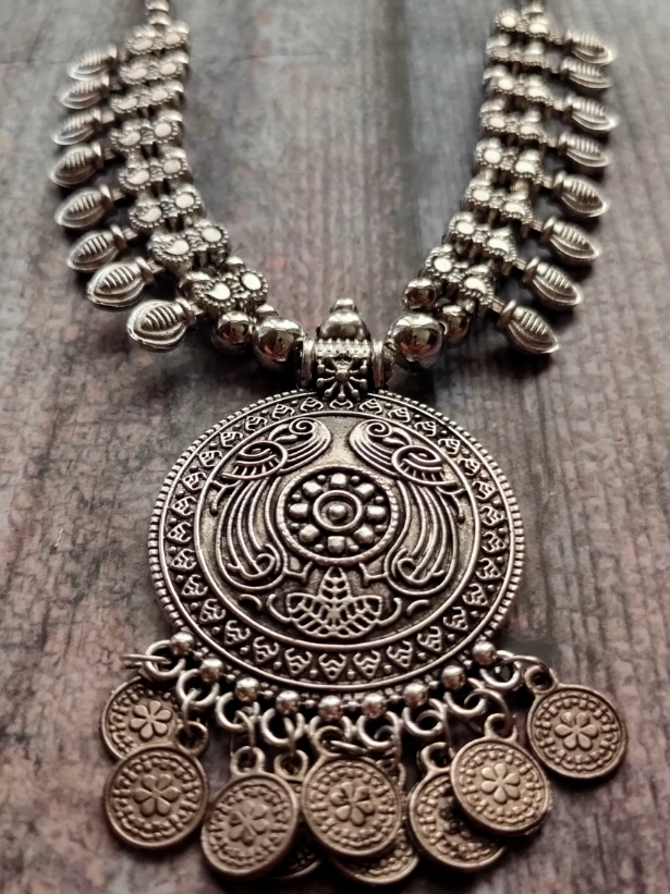 Intricately Crafted Metal Necklace with Coins and Peacock Detailing