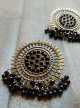 Sun Shaped Metal Earrings with Concentric Circles and Black Beads