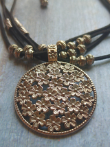 4 Layer Necklace Set with Intricately Detailed Metal Pendant