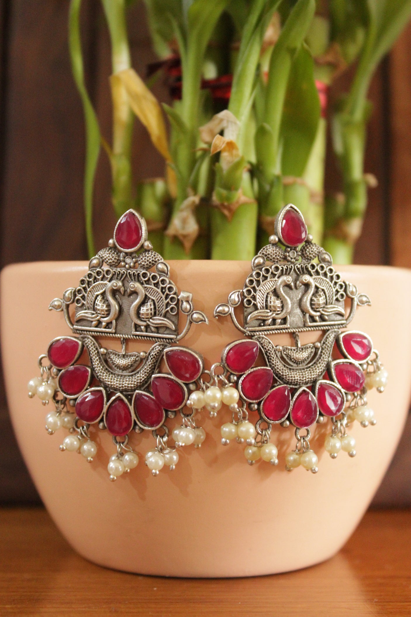 Ruby Red Glass Stones Embedded Peacock Motifs Detailed Brass Earrings