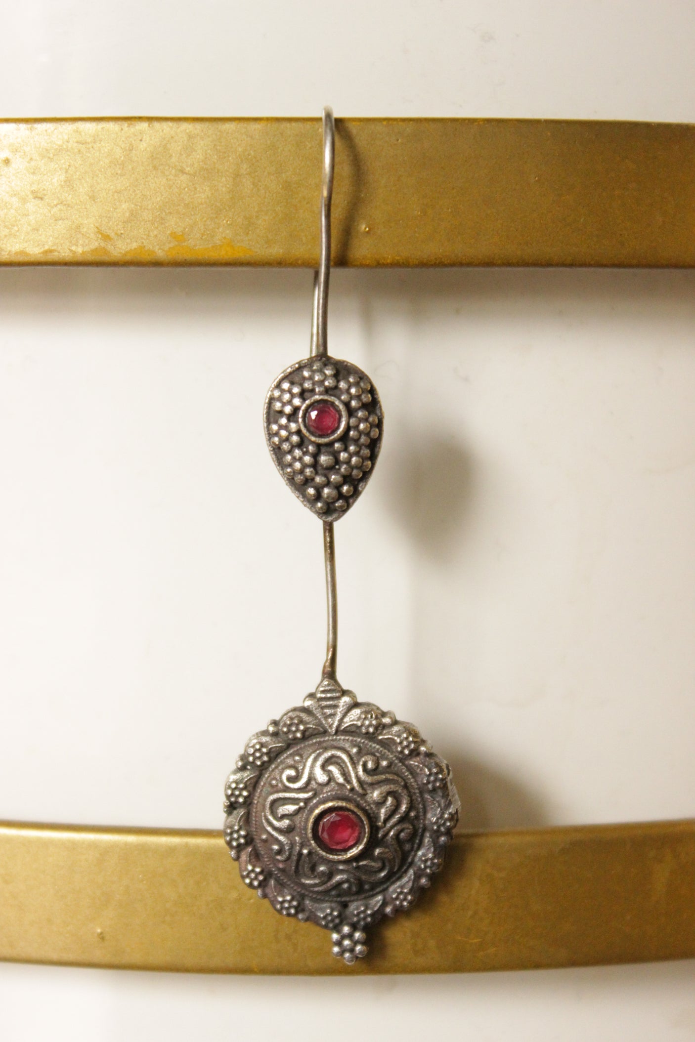 Oxidised Finish Metal Dangler Earrings Embellished with Pink Center Stone