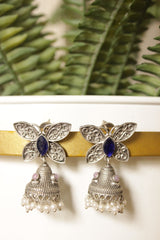 Purple Center Stone Silver Finish Butterfly Brass Jhumka Earrings