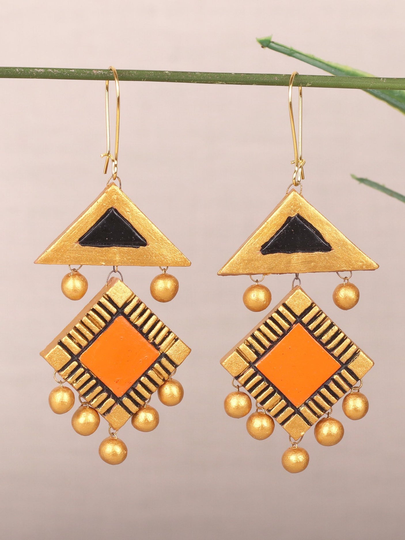 Trendy Triangular Orange Danglers - A Local Tribe